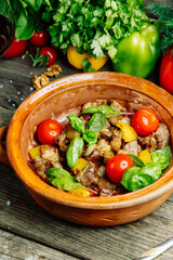 Beef stew, restaurant dish. Vegetable stew with beef in a clay bowl.