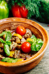 Beef stew, restaurant dish. Vegetable stew with beef in a clay bowl.