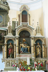 Fototapeta na wymiar Altar of Our Lady of Sorrows in the parish church of Saint John the Baptist in Sveti Ivan Zelina, Croatia