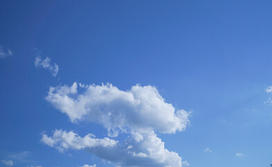 Naklejka na ściany i meble Bright blue sky with clouds and clear space without clouds