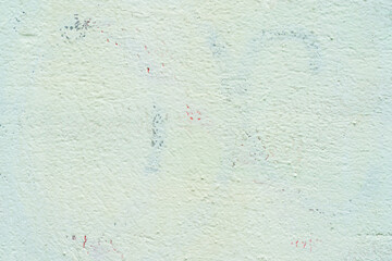 Light green stucco. Texture of wall of old house. Abstract architectural background.