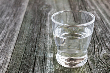 a glass of water on ecological wooden table