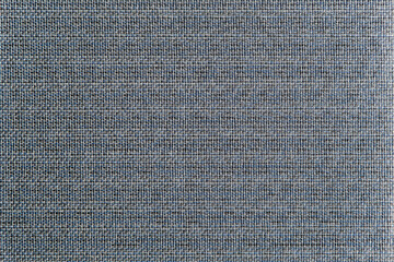 Light grey background. Geometric pattern. Woven material. Horizontal and vertical threads. Wicker decorative surface.