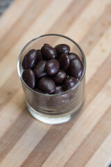 chocolate almonds and nuts in a glass on the table