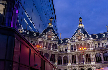 The facade of the Chambre de commerce et d'industrie of Lyon, reflected in the mirrored windows of...