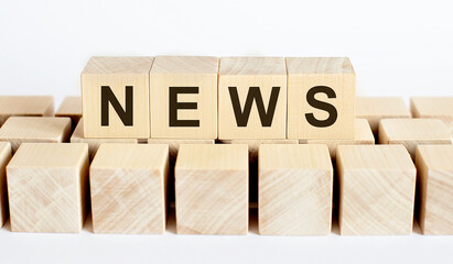 NEWS word from wooden blocks on desk, search engine optimization concept