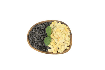 Pumpkin and sunflower seeds, on a white background. Sunflower seeds for cooking oil. Natural ingredient, in a wooden brown plate. Vitamin product.