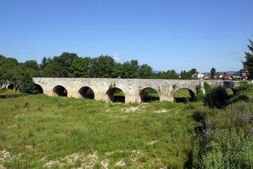 Fototapeta na wymiar Marmont Bridge, an old stone bridge in Ostarije, Croatia