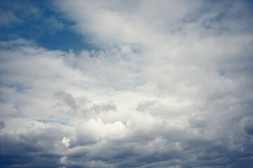 Naklejka na ściany i meble Tinted dark blue sky and clouds