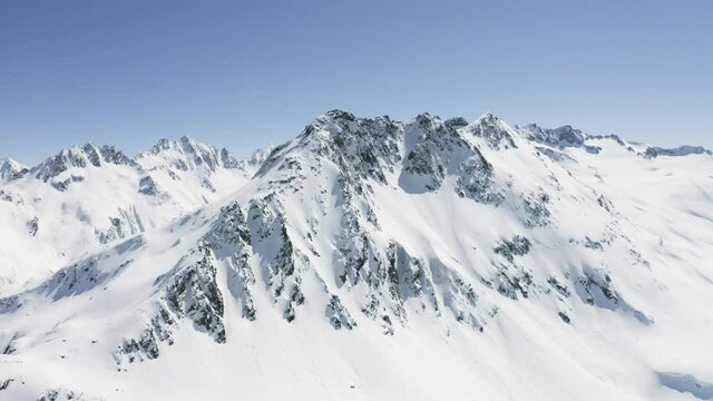 Aerial footage of a mountain range in Switzerland.