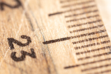 Close up of the number twenty three on a wooden ruler.