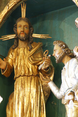Obraz premium Jesus gives the keys to St. Peter, a statue on the high altar in St. Peter's Parish Church in Sveti Petar Mreznicki, Croatia