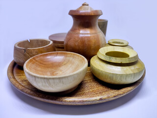 Traditional wooden craft jars for spices. Isolate on a white background. Selective focus.