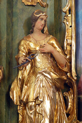 Saint Apollonia, statue on the altar of St. Barbara at St. Peter's Parish Church in Sveti Petar...