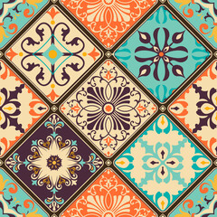 Seamless colorful patchwork tile with Islam, Arabic, Indian, Ottoman motifs. Majolica pottery tile. Portuguese and Spain decor. Azulejo. Ceramic tile in talavera style. Boho pattern