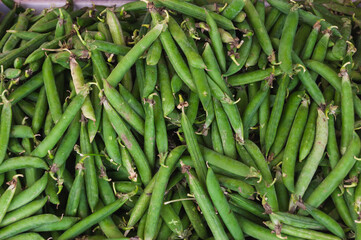 young peas at the farmers  market. healthy food concept