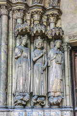 Saint-Germain-l'Auxerrois Church situated in Paris, France. Founded in 7 century, church rebuilt many times over several centuries. Sculptures at the entrance to the church.