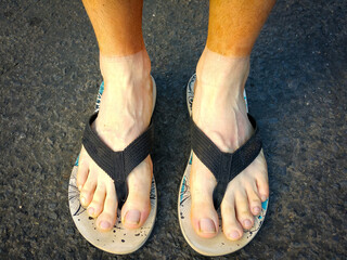 Red dusty feet after taking off socks after a hike in the Grand Canyon