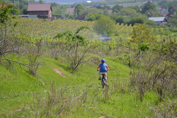 Obraz premium Child cycling in nature 