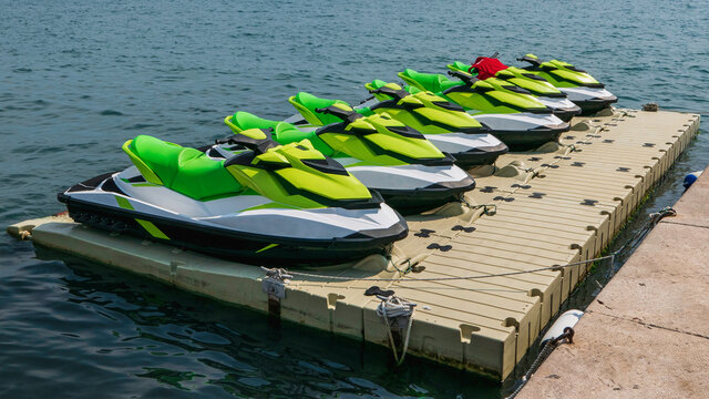 Jet skis docked on floating pontoon in Croatia, holiday destination.