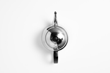 Stainless steel teapot isolated on a white background. High-resolution photo.