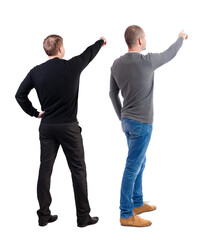 Back view of two man in sweater pointing.