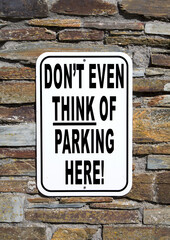 Obraz premium No Parking sign - on the wall of a private residence. Humorous no parking sign. 