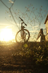 Fototapeta na wymiar bike on the road while the sun rises
