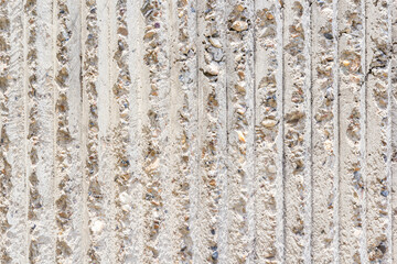 Cement wall texture with vertical pattern on day noon light for interior or exterior brick wall building and decoration texture background.