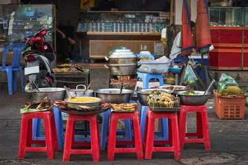 Asian fresh street food on the chairs in Cambodia
