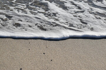 Fototapeta na wymiar wave on the sand