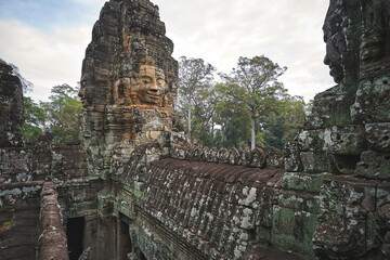 Fototapeta premium Bayon khmer temple with smiling stone faces at Angkor Wat complex in Cambodia
