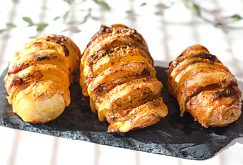 Homemade Hasselback Potatoes with bacon and cheese