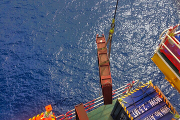 Condenser coil lifted down from an offshore rig platform