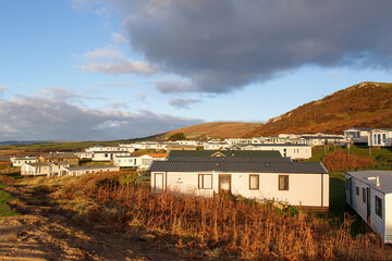 Static caravan holiday homes at Llangennith on the Gower Peninsular in winter which is out of...