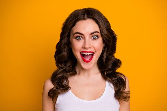 Closeup photo of charming pretty crazy lady cheerful person good mood open mouth listen amazing news wear white casual singlet isolated yellow color background