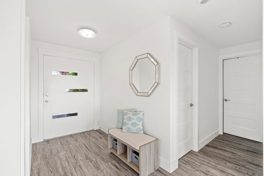Beautiful white hallway interior with grey hardwood floors