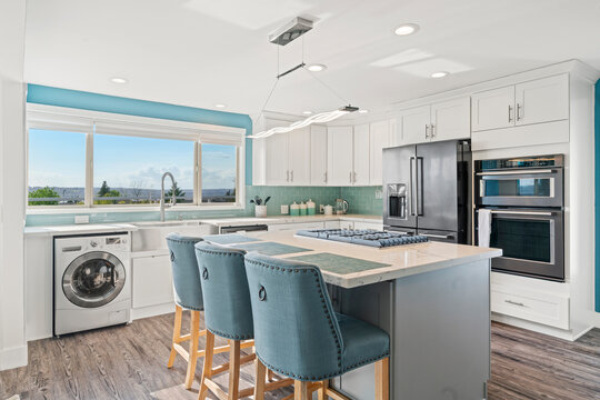 White Modern Kitchen Interior With Navy Blue Accents