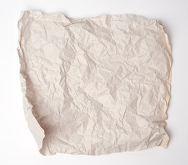 crumpled gray square piece of paper on a white background