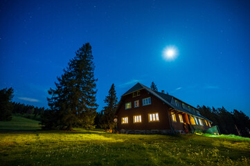 Hut Stuebenwasen in the Black Forest during the night with moonlight