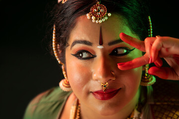 Bharatnatyam dancer giving a mesmerizing performance with her bold eyes. 
