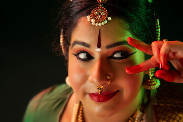 Bharatnatyam dancer giving a mesmerizing performance with her bold eyes. 
