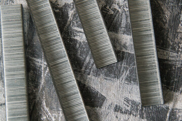 Concept of repair and construction. Construction brackets on the background of dark gray decorative...