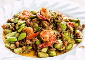 Stir fried  bitter  beans with shrimp in plate , Thai famous food