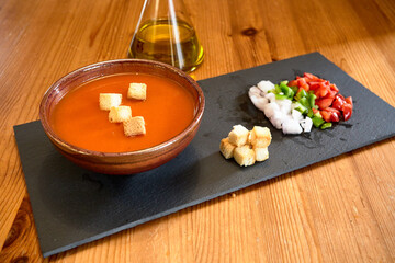 Obraz na płótnie Canvas Tomato Gazpacho Cook Onion Garlic Spoon Toasted Bread selective focus