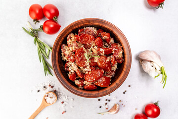 Dried tomato with olive oil and herbs. Food recipe background. space for text. top view
