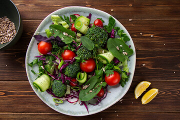Raw vegetable salad with broccoli cherry cucumber