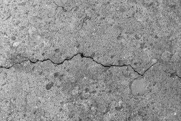 Cracked concrete texture closeup. Abstract cement background.