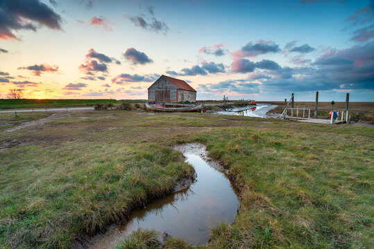 Sunset over the old coal barn at Thornham