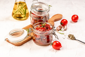 Sun dried tomatoes with garlic, oregano, olive oil in a bowl. Delicious snack, top view